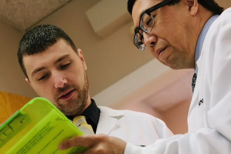 Dr. Nore explaining a treatment option to a patient