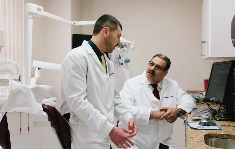 Doctors talking in a treatment room