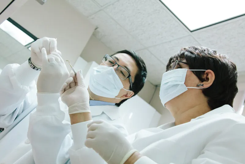 Dentist examining a patient in the chair