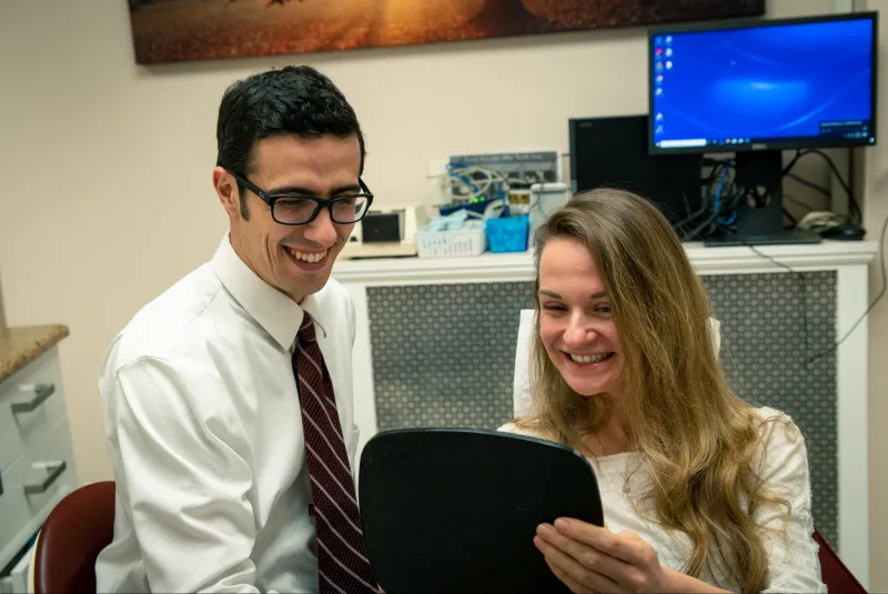 Doctor sharing results with a patient at the front desk