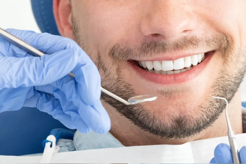 Patient smiling during a dental exam