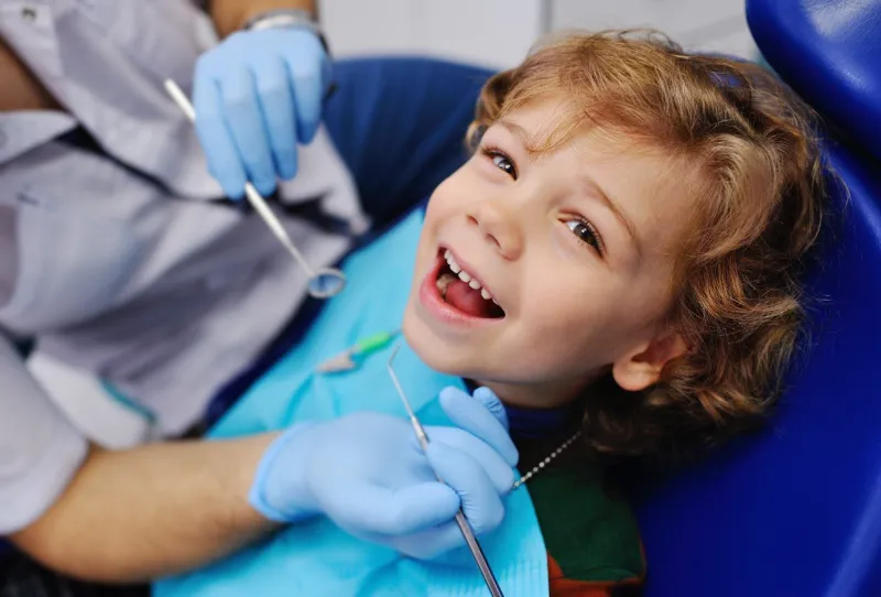 Young child smiling in the dental chair
